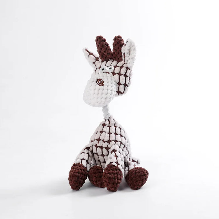 Crocheted giraffe toy with white and brown pattern on a light gray background